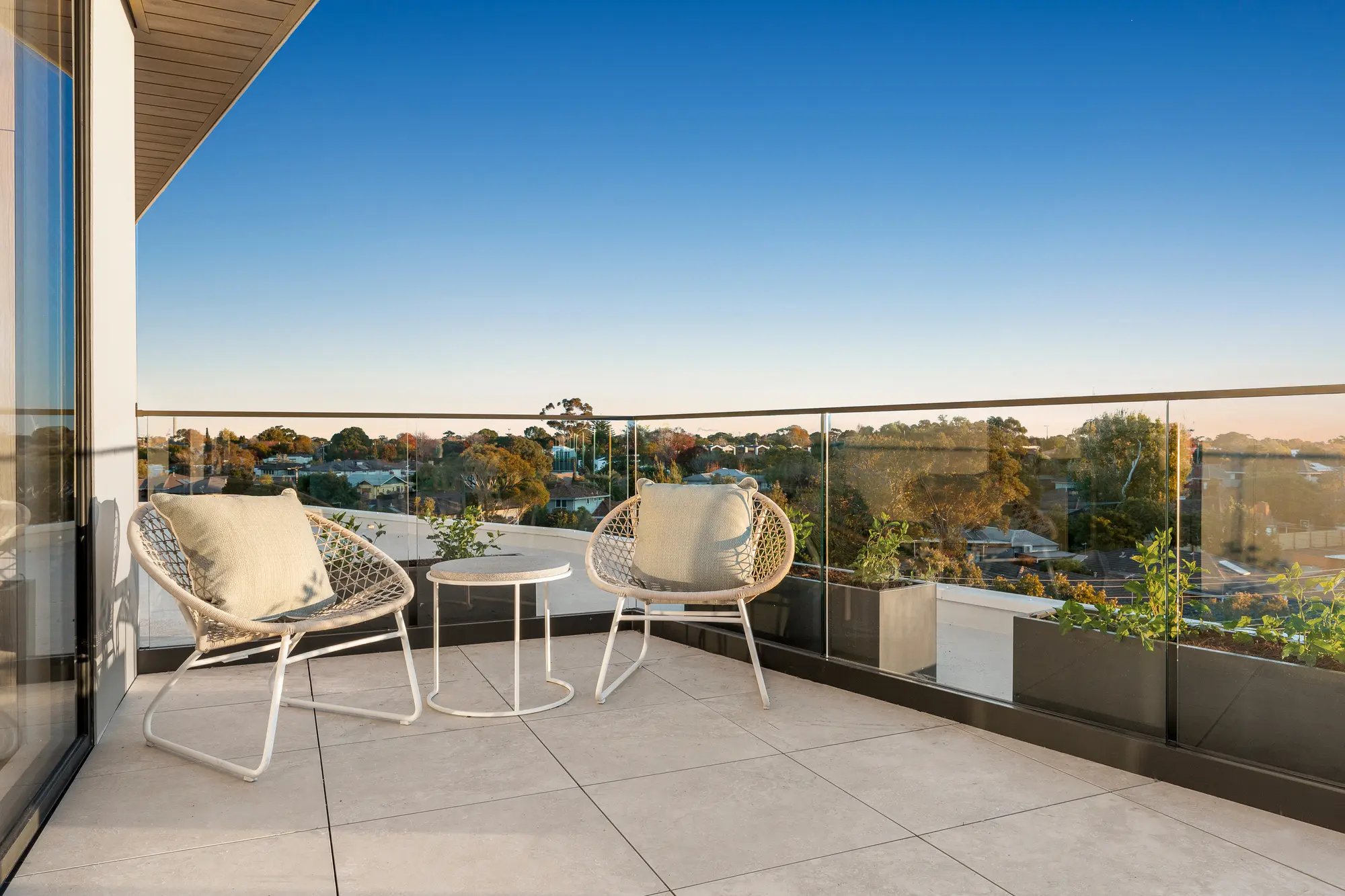 Balcony at Iridian Hampton East overlooking the bayside treetops
