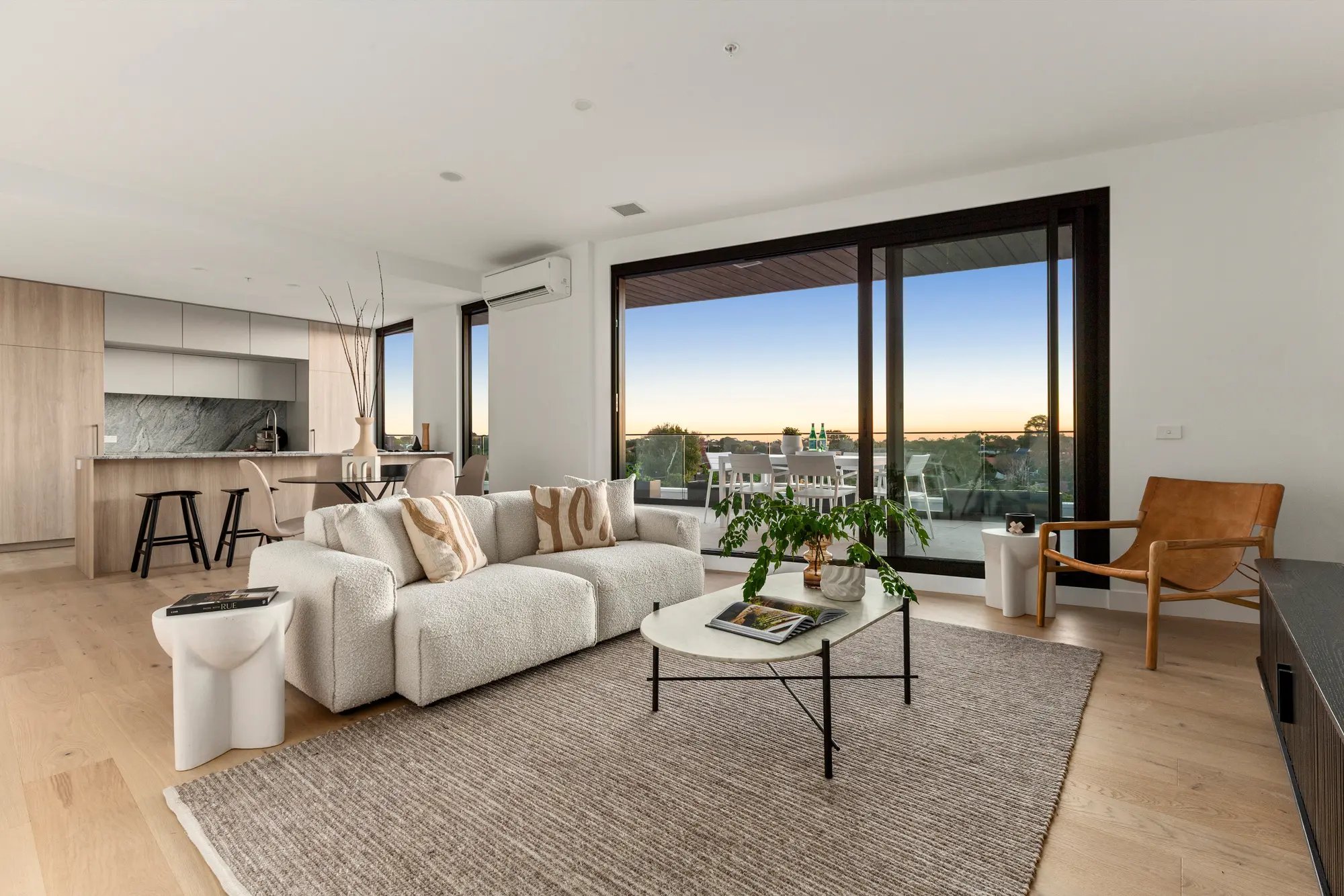 Light-filled living and dining room at Iridian Hampton East